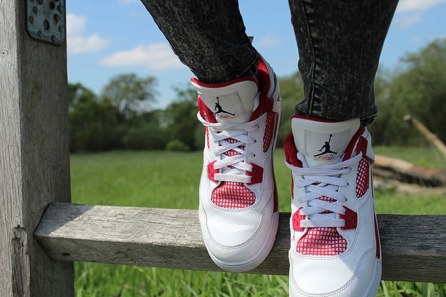person wearing pair of red-and-white Air Jordan shoes, person wearing white-and-red Air Jordan Flight shoes, HD wallpaper