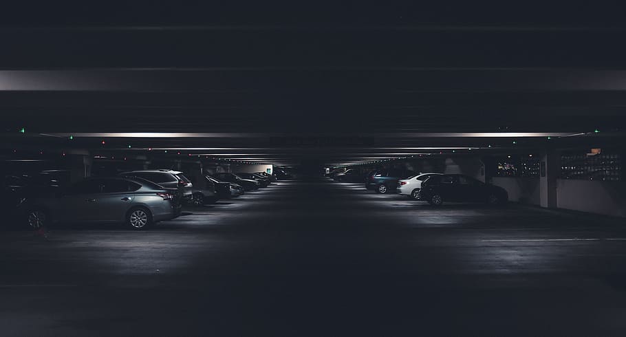 vehicles parked on parking area, dark, ground, basement, car