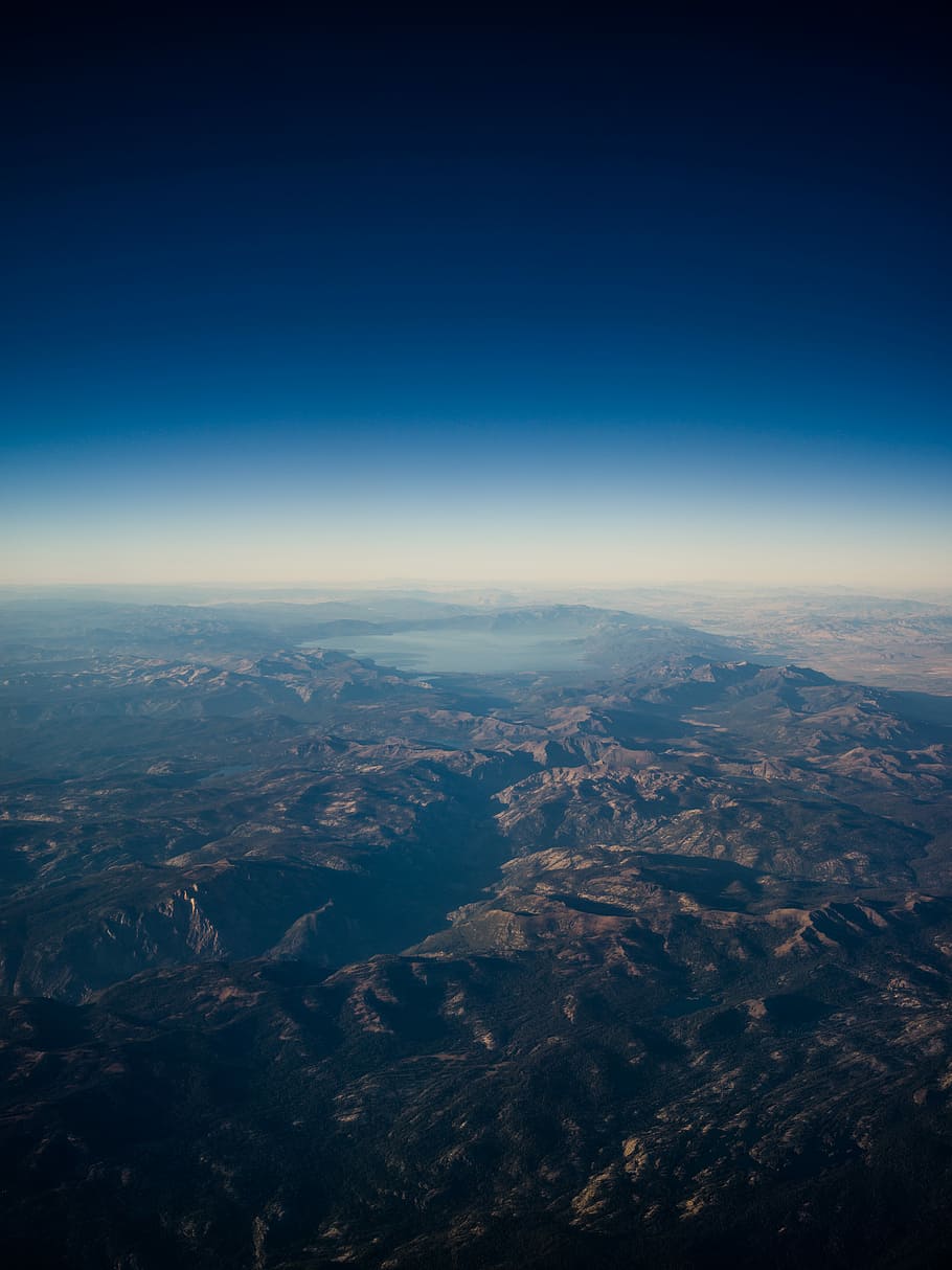 satellite photography of rocky mountains near lake, bird's-eye view of mountain ridge HD wallpaper