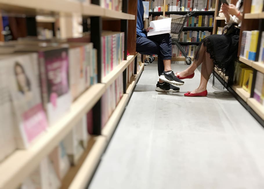 Hd Wallpaper Man And Woman Sitting Inside Library Books Shelf Legs