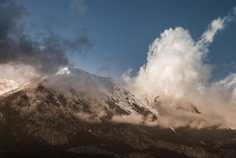 mountain cover by clouds, white and grey mountain with white snow and clouds under the blue sky during daytime HD wallpaper