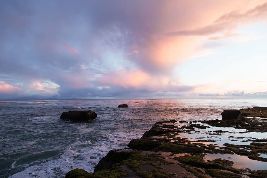 body of water, sunset, sky, clouds, beach, rocks, shore, waves HD wallpaper