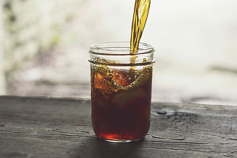 clear glass jar with yellow and red liquid, brown liquid on clear glass jar HD wallpaper