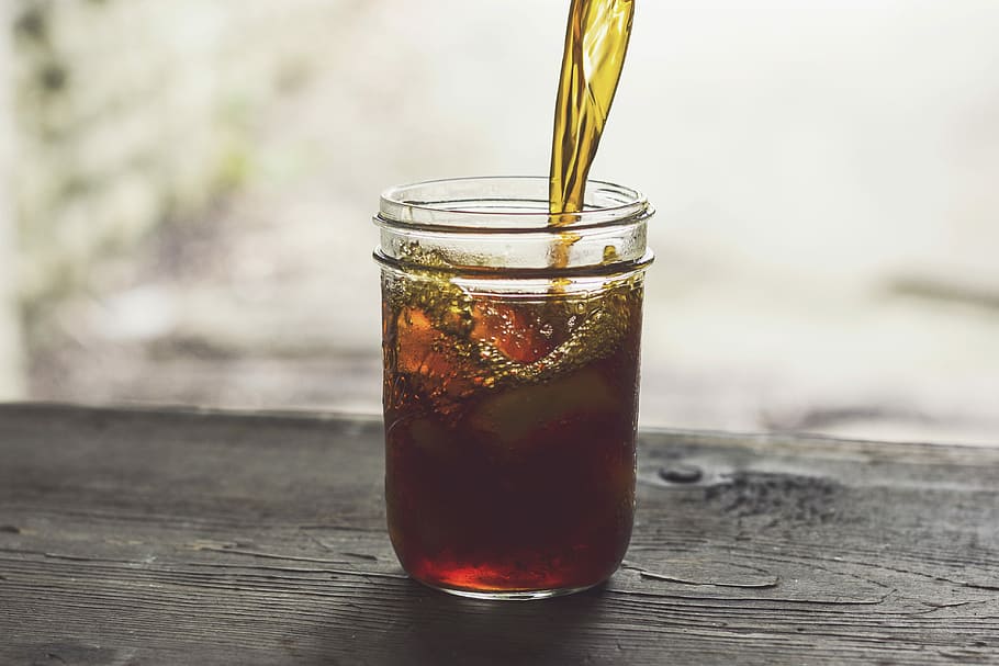 clear glass jar with yellow and red liquid, brown liquid on clear glass jar HD wallpaper