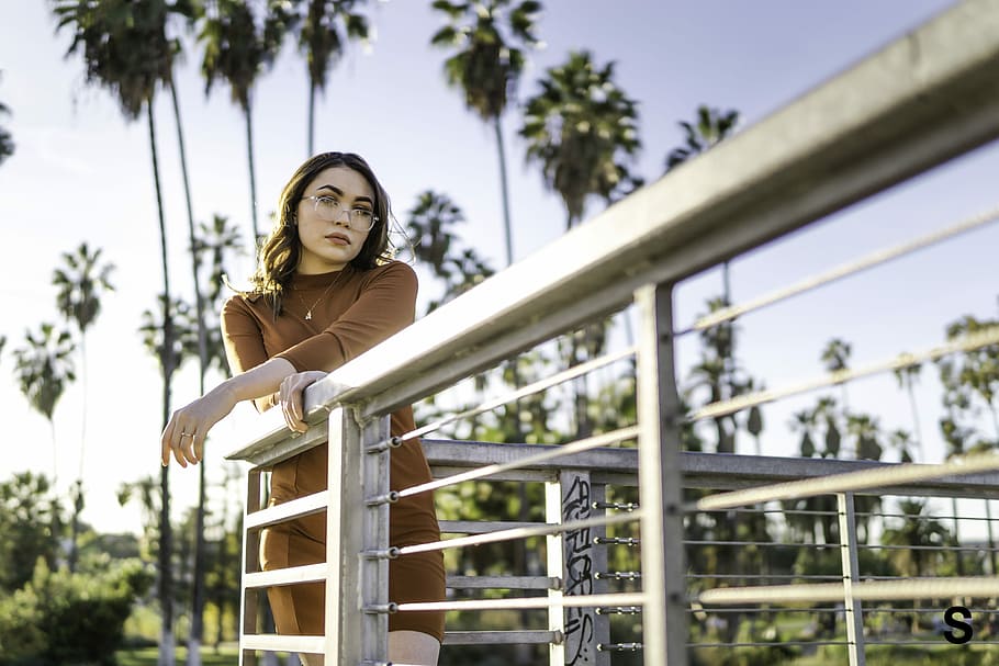 woman standing on corner terrace leaning on rail, portrait HD wallpaper