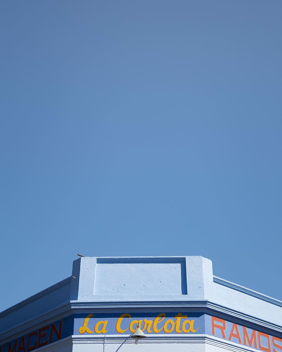 La Carlota building under blue sky during daytime, photo of La Carlota storefront during daytime HD wallpaper