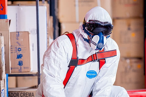 photo of man in white safety suit near cardboard boxes, chemist HD wallpaper