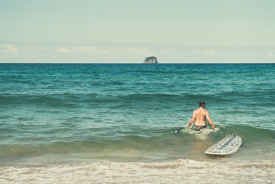 man walking in body of water with surfboard, beach, surfer HD wallpaper